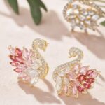 a pair of elegant and luxurious court style earrings featuring delicate duck and romantic swan designs, perfect for valentine's day gifts and essential for business dinners